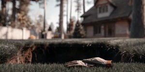 Setting the best mole trap with work gloves in an active mole tunnel on a lawn.