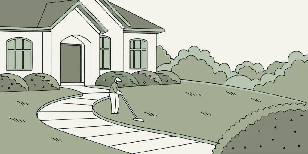 A homeowner setting a professional mole killer trap in a lawn mole tunnel.